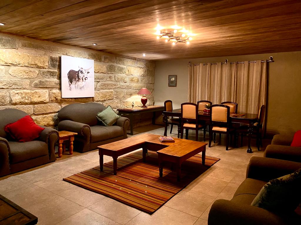 Living room and dining area at Di Plek guesthouse on a farm in Clarence.